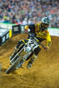 After the rear wheel hits and the suspension absorbs the sharpest part of the impact, the rider chops the throttle. The bump would tend to slap the front end down, so he just lets that happen to get the wheels back on the ground quickly and with good control to regain traction and drive.